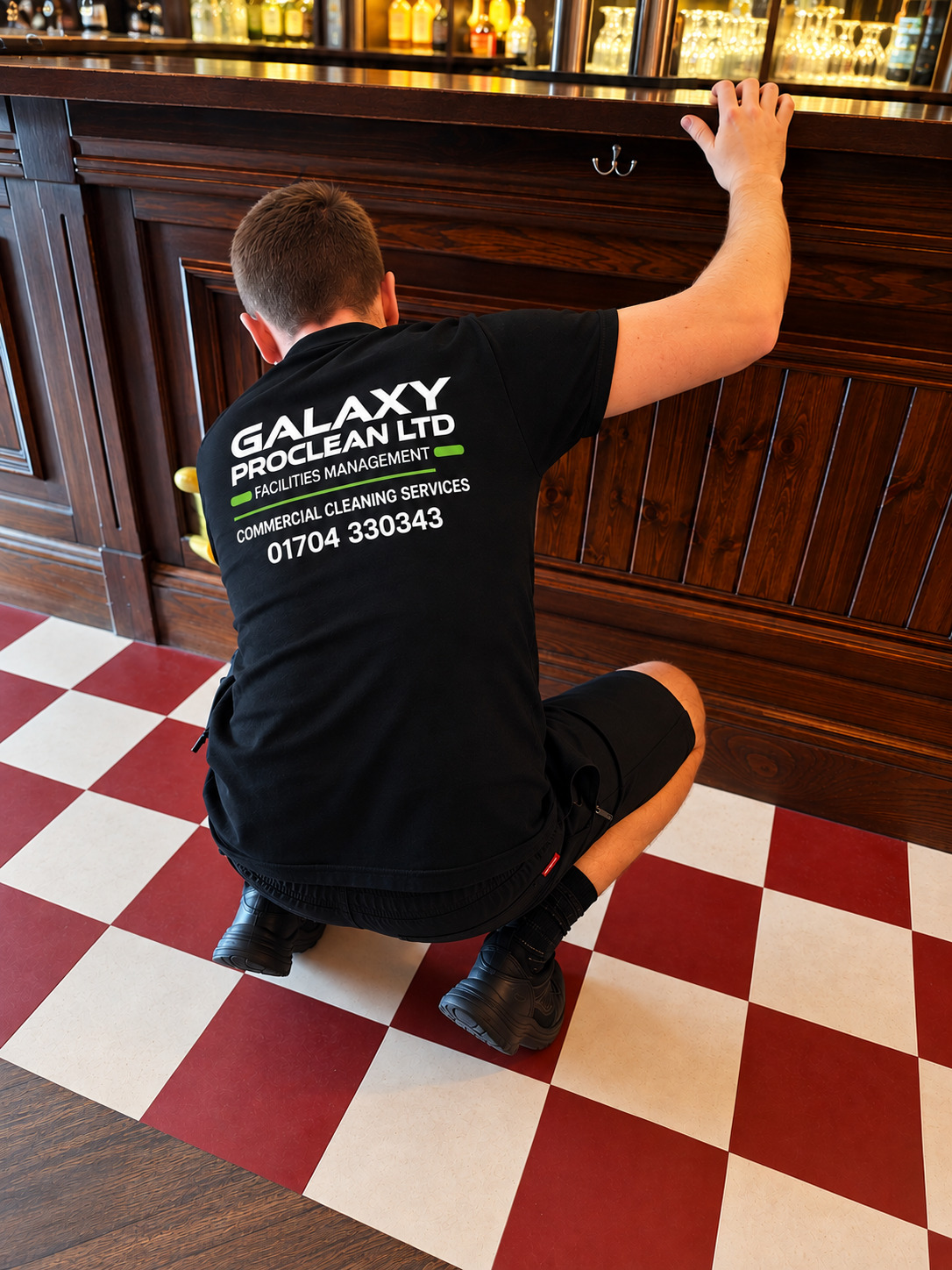 cleaning technician cleaning woodwork